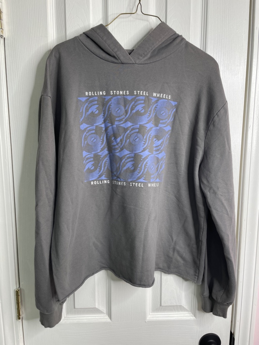 the Rolling Stones Gray Sweatshirt with Subtle Black Logo and Yellow Accent.
